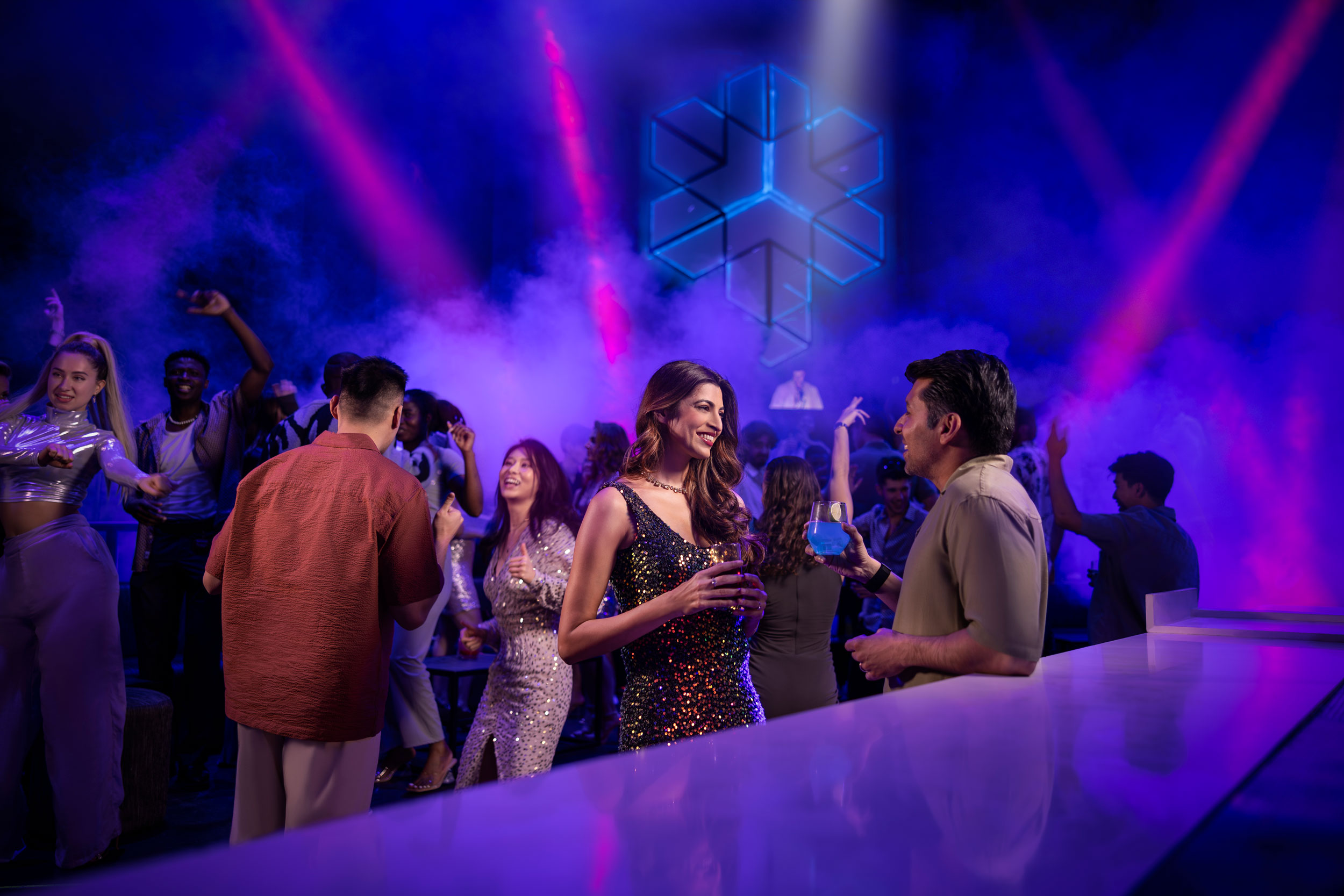 Man and woman chatting at a Yas Island nightclub